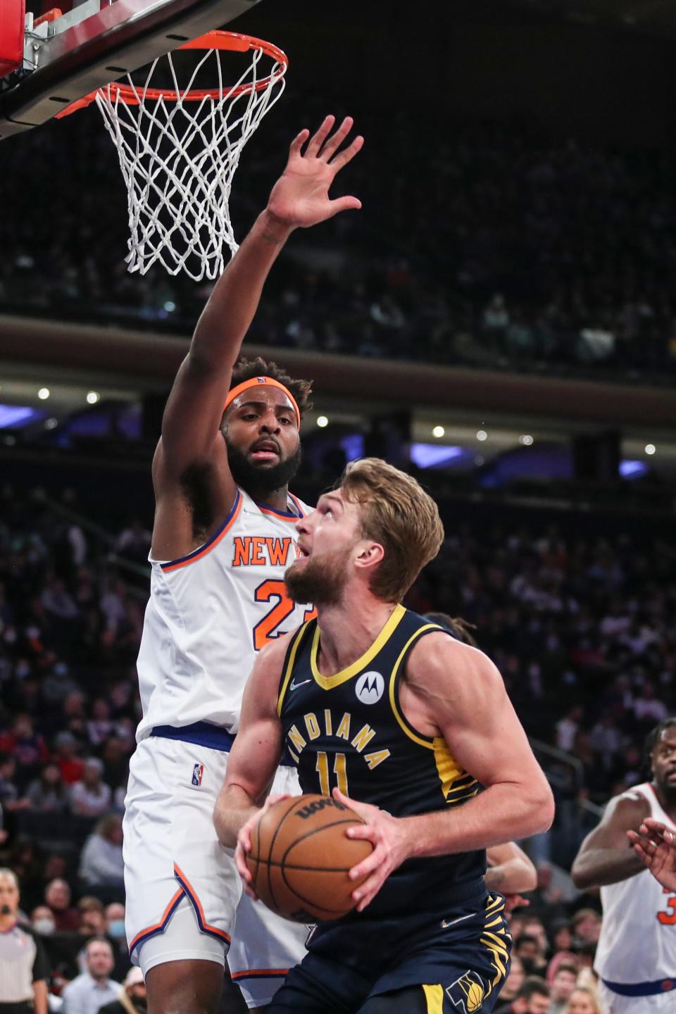 Jan 4, 2022; New York, New York, USA;  Indiana Pacers forward Domantas Sabonis (11) looks to post up against New York Knicks center Mitchell Robinson (23) in the second quarter at Madison Square Garden. Mandatory Credit: Wendell Cruz-USA TODAY Sports
