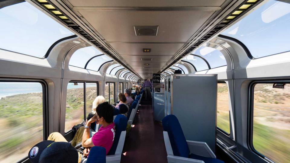 Observation carriage of a long distance train travelling along the scenic Californian coastline. USA