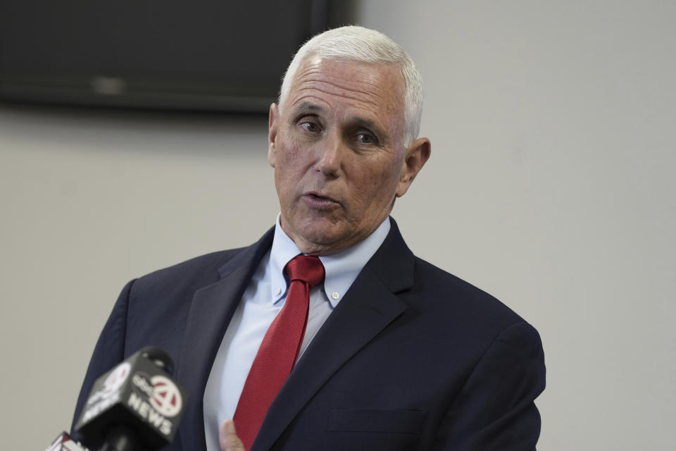 FILE - Former Vice President Mike Pence speaks with reporters following a roundtable discussion on police reform on March 2, 2023, in North Charleston, S.C. Pence and Bernie Sanders are hardly political allies. But in the aftermath of two large bank failures, the former vice president and the democratic socialist senator are striking remarkably similar tones. (AP Photo/Meg Kinnard, File)