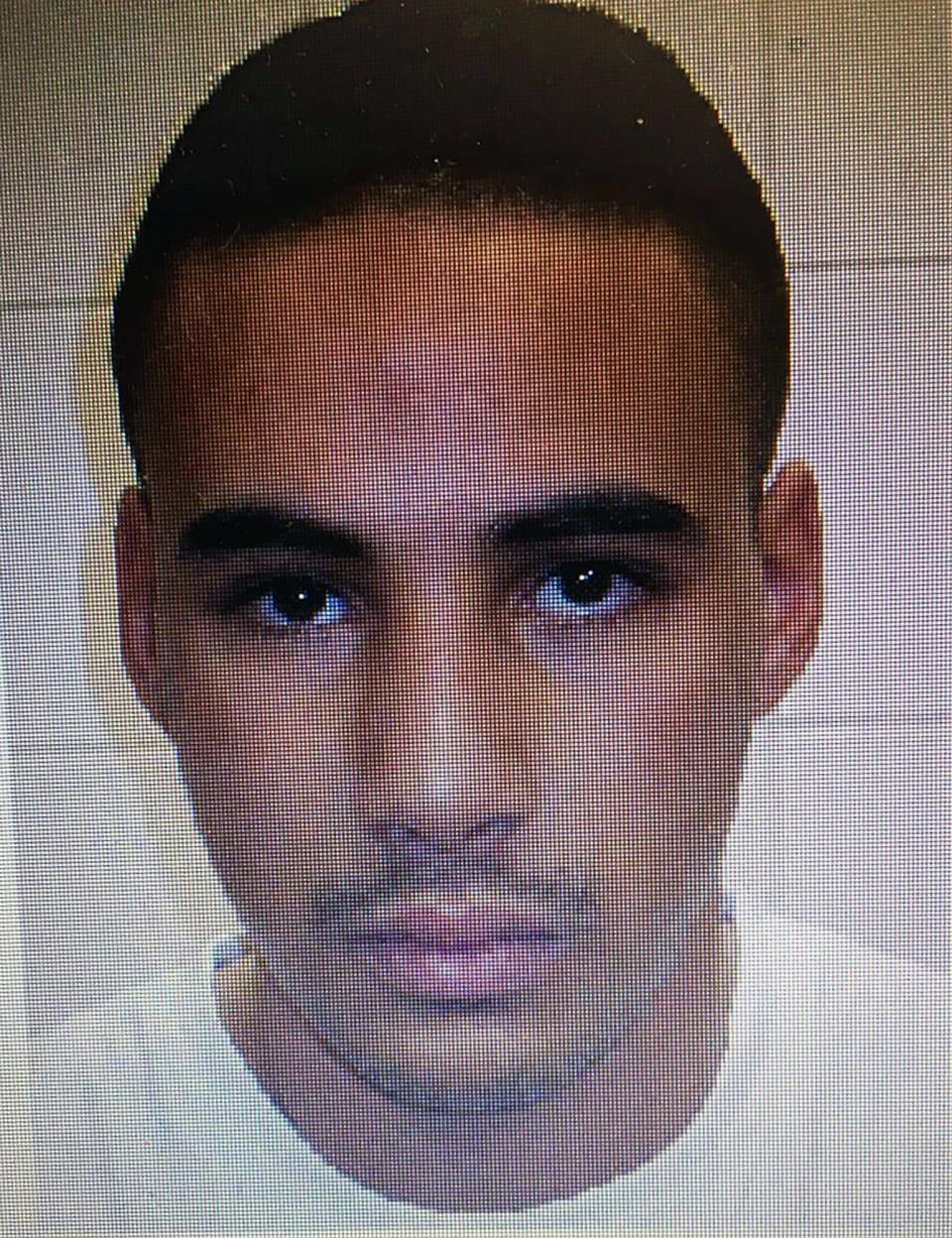 This undated handout photo provided by the French police, shows Cherif Chekatt, the suspect in the shooting in Strasbourg, France on Tuesday Dec. 11, 2018. Police union officials identified the suspected assailant as Cherif Chekatt, a 29-year-old with a thick police record for crimes including armed robbery and monitored as a suspected religious radical by the French intelligence services. The suspect sprayed gunfire near the famous Christmas market in the eastern French city, killing three people, wounding up to a dozen and sparking a massive manhunt when he got away. (French Police via AP)