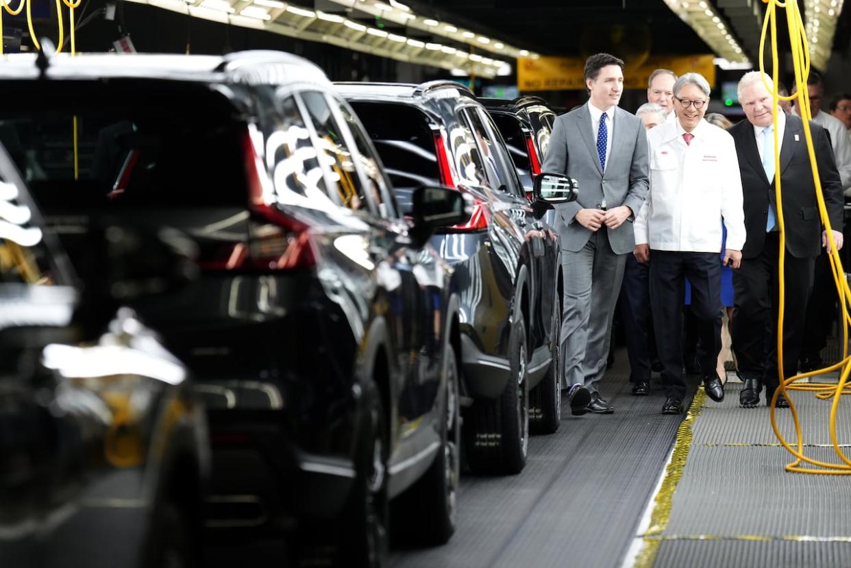 Honda Canada's $15-billion investment to establish a Canadian electric vehicle supply chain was announced last month by, left to right, Prime Minister Justin Trudeau, CEO Toshihiro Mibe and Ontario Premier Doug Ford. (Nathan Denette/The Canadian Press - image credit)