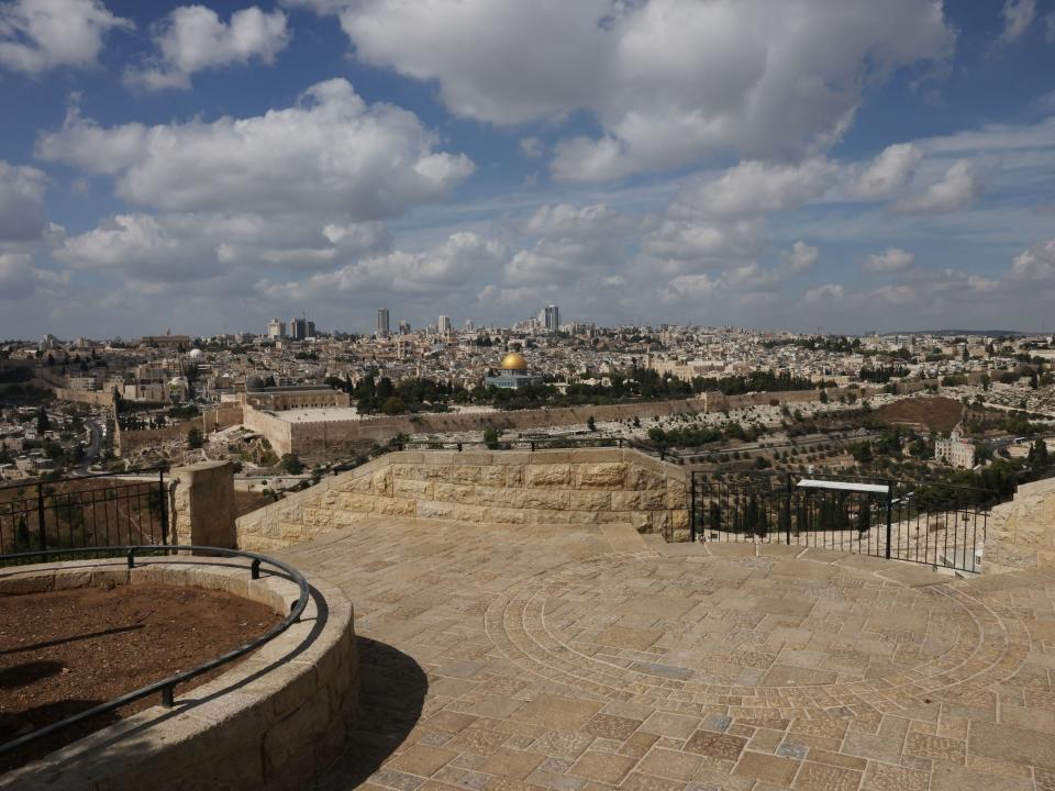 The empty Mount of Olives touristic site overlooking Jerusalem's Dome of the Rock.