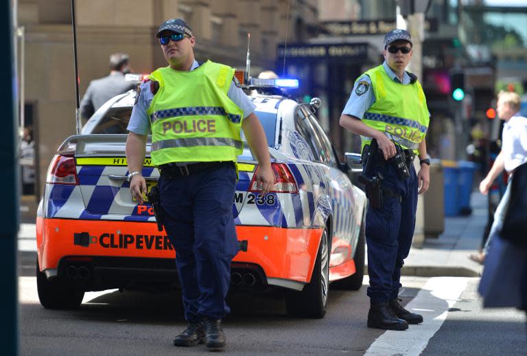 File photo of policemen closing a street during a Sydney cafe siege on December 15, 2014