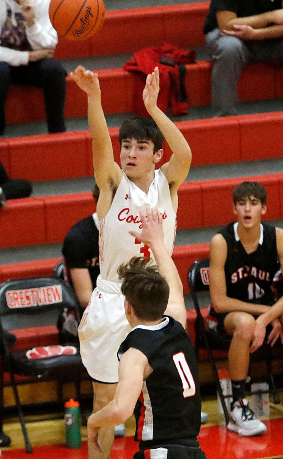 Crestview High School's Heath Kash (3) shoots over St. Paul High School's Thomas Bocock (0) during high school basketball action at Crestview High School on Thursday, Dec. 9, 2021. TOM E. PUSKAR/TIMES-GAZETTE.COM