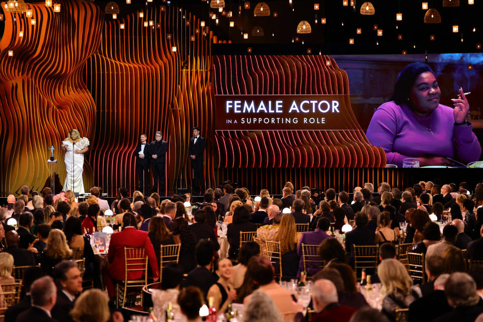 LOS ANGELES, CALIFORNIA - FEBRUARY 24: (L-R) Da'Vine Joy Randolph accepts the Outstanding Performance by a Female Actor in a Supporting Role award for “The Holdovers” from Elijah Wood and Sean Astin onstage during the 30th Annual Screen Actors Guild Awards at Shrine Auditorium and Expo Hall on February 24, 2024 in Los Angeles, California. (Photo by Matt Winkelmeyer/Getty Images)