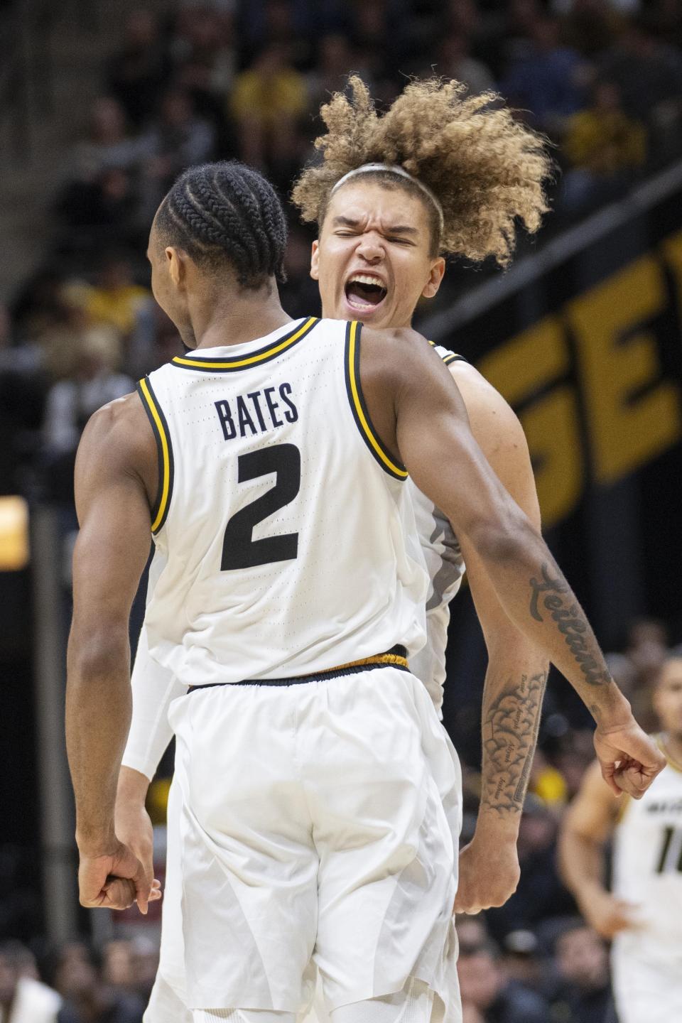 Missouri's Noah Carter, right, celebrates a dunk by Tamar Bates during the second half of an NCAA college basketball game against Wichita State, Sunday, Dec. 3, 2023, in Columbia, Mo. (AP Photo/L.G. Patterson)