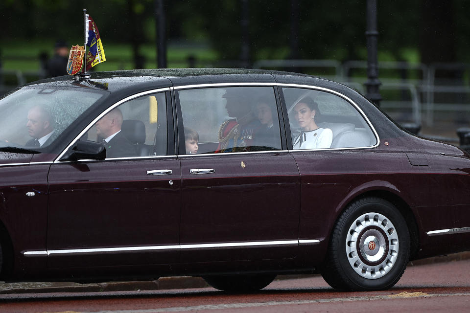 Britain's Catherine, Princess of Wales, (R) arrives with Britain's Prince William, Prince of Wales, (rear 3rdR) and their children Britain's Prince George of Wales (2ndR) and Britain's Prince Louis of Wales (C) to Buckingham Palace before the King's Birthday Parade "Trooping the Colour" in London on June 15, 2024. Catherine, Princess of Wales, is making a tentative return to public life for the first time since being diagnosed with cancer, attending the Trooping the Colour military parade in central London. (Photo by HENRY NICHOLLS / AFP) (Photo by HENRY NICHOLLS/AFP via Getty Images)