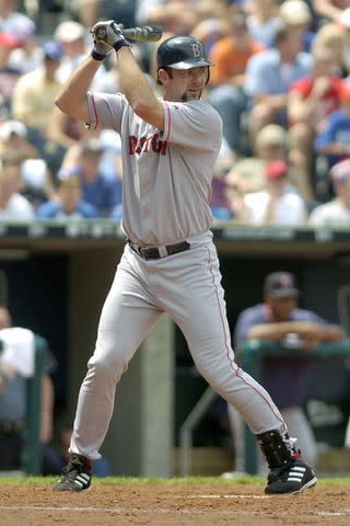 <p>John Williamson/MLB via Getty</p> Dave McCarty plays a game in Kansas City, Missouri in June 2004