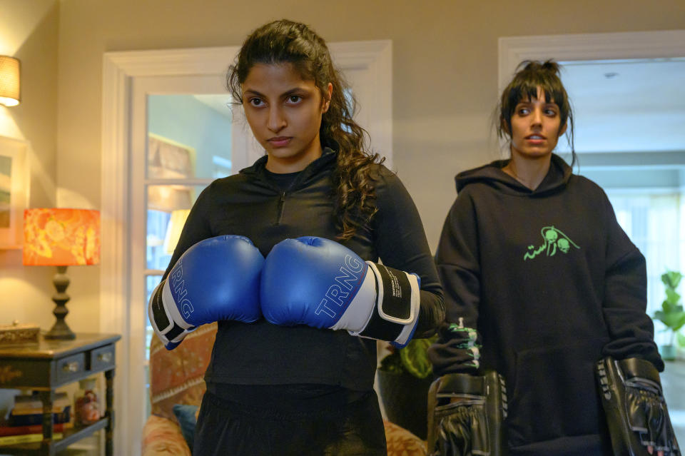 This image released by Focus Features shows Priya Kansara, left, and Ritu Arya in a scene from "Polite Society." (Parisa Taghizadeh/Focus Features via AP)