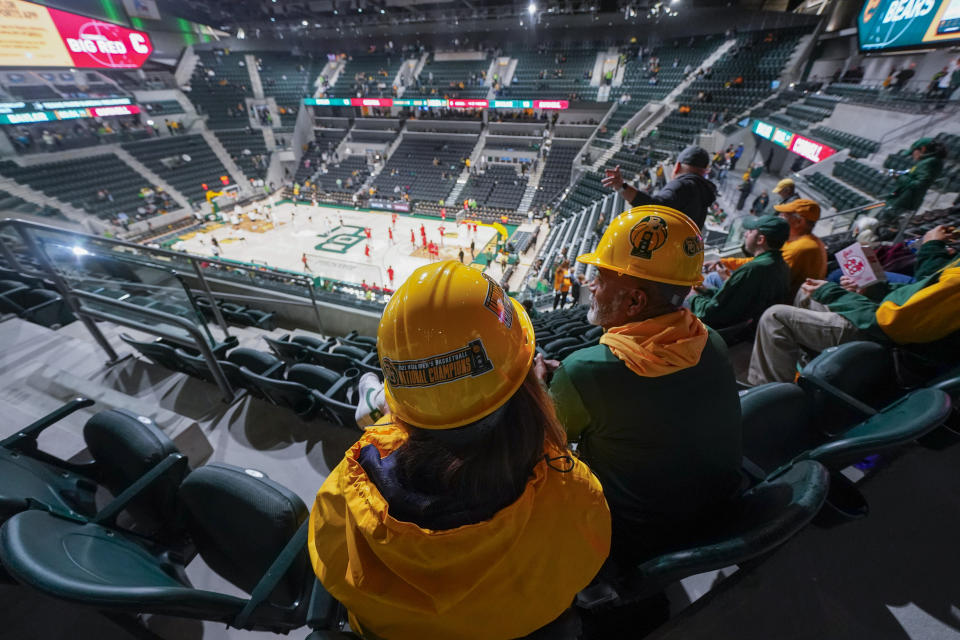 Spectators take their seats prior to the first event at Foster Pavilion, an NCAA college basketball game between Baylor and Cornell, Tuesday, Jan. 2, 2024, in Waco, Texas. (AP Photo/Julio Cortez)