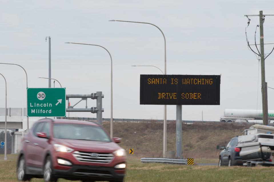 Drivers pass an electronic DelDOT sign, with a reference to Santa, along Delaware Route 1 south of Milford.