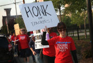 Striking Chicago public school teachers picket outside of George Westinghouse College Prep high school on September 17, 2012 in Chicago, Illinois. More than 26,000 teachers and support staff walked off of their jobs on September 10 after the Chicago Teachers Union failed to reach an agreement with the city on compensation, benefits and job security. With about 350,000 students, the Chicago school district is the third largest in the United States. (Photo by Scott Olson/Getty Images)