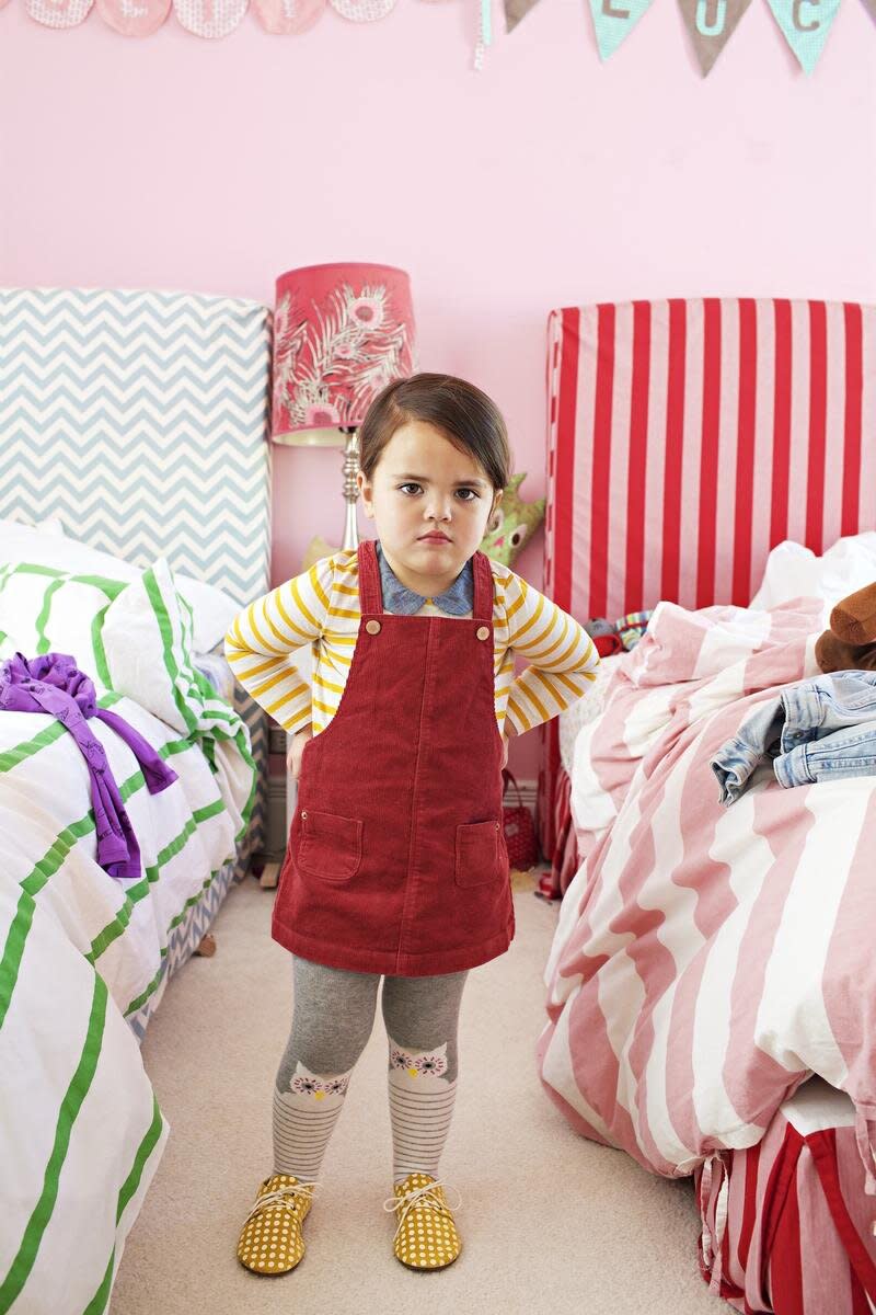 Angry Toddler Wearing Red Overalls