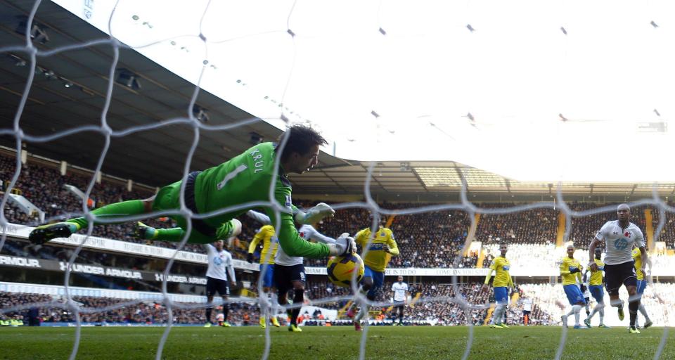 Newcastle United goalkeeper Tim Krul makes a save from Tottenham Hotspur's Gylfi Sigurdsson during their English Premier League soccer match at White Hart Lane in London November 10, 2013.