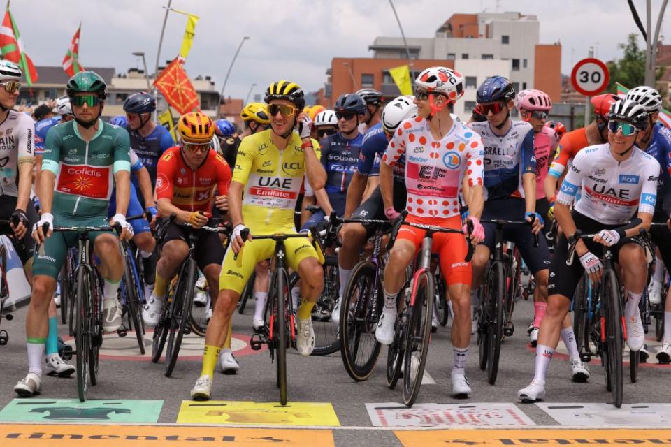 Cofidis French rider Victor Lafay L wearing the best sprinters green jersey UAE Team Emirates British rider Adam Yates C wearing the overall leaders yellow jersey EF Education  Easyposts US rider Neilson Powless 2nd R wearing the best climbers polka dot dotted jersey and UAE Team Emirates Slovenian rider Tadej Pogacar R wearing the best young riders white jersey await the start of the 3rd stage of the 110th edition of the Tour de France cycling race 1935 km between AmorebietaEtxano in Northern Spain and Bayonne in southwestern France on July 3 2023 Photo by Thomas SAMSON  AFP Photo by THOMAS SAMSONAFP via Getty Images