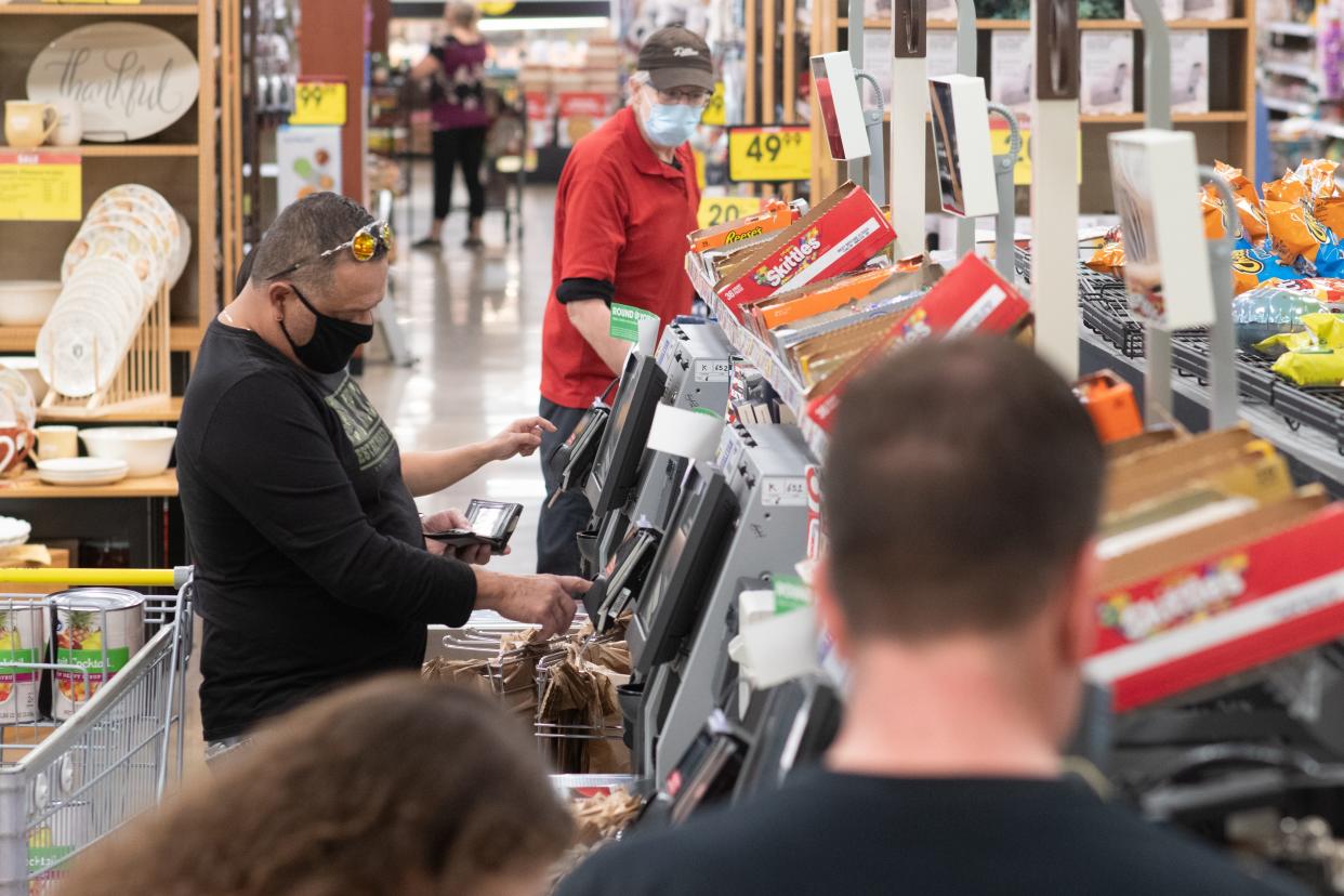 Grocery shoppers use the self-checkout lanes at Dillons, 800 N.W. 25th St., in Topeka.