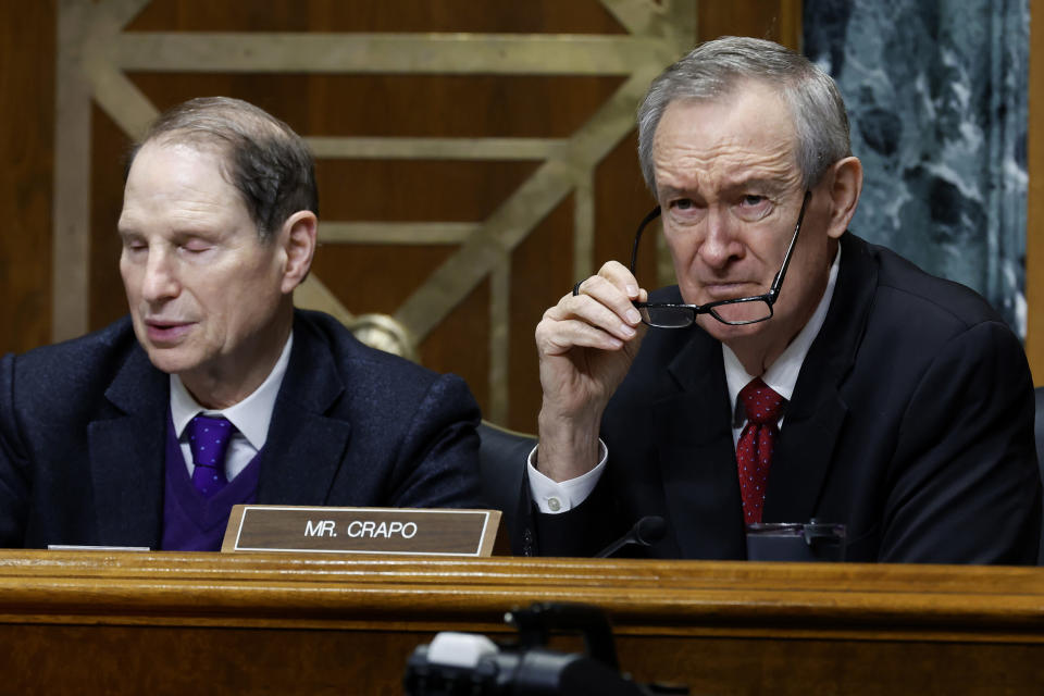 Republican Sen. Mike Crapo of Idaho, right, is the leading opponent of a bipartisan tax package that would expand benefits for families. Democratic Sen. Ron Wyden of Oregon, left, who chairs the finance committee struck the deal with Rep. Jason Smith, a Missouri Republican. (Chip Somodevilla/Getty Images)