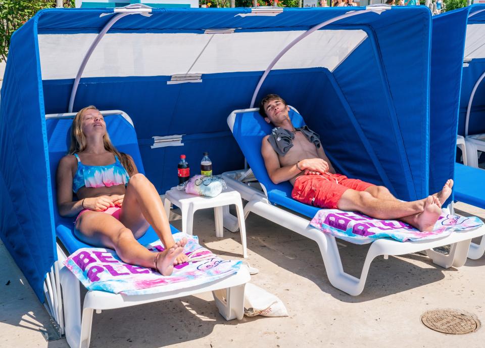 Guests relaxing in Six Flags Hurricane Harbor's new advanced seating options.