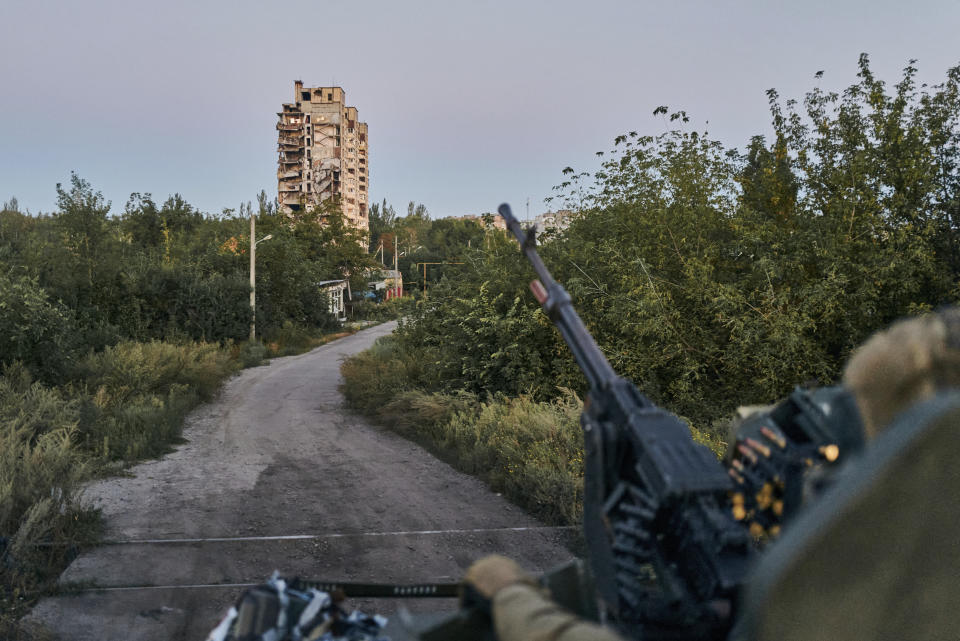 FILE - A Ukrainian soldier sits in his position in Avdiivka, Donetsk region, Ukraine, on Aug. 18, 2023. Ukrainian forces claimed Thursday, Feb. 8, 2024, to have shot down a Russian attack helicopter near the eastern Ukraine city of Avdiivka, where the sides are fighting from street to street as the Kremlin’s forces step up their four-month campaign to surround Kyiv’s defending troops. (AP Photo/Libkos, File)