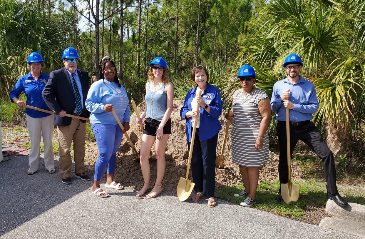 Dignitaries, students, alumni and FGCU President Mike Martin break ground on the Bill & Nancy Malthouse-Pilot Scholarship House in North Lake Village in 2018. Photo by Kyle McCurry for FGCU