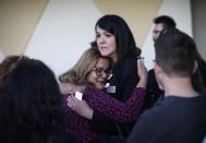 <p>Maritza Rodriguez, right, embraces Emily Zamora after a special service at Guardian Angel Cathedral for the mass shooting on the Las Vegas Strip, Monday, Oct. 2, 2017, in Las Vegas. (Photo: John Locher/AP) </p>