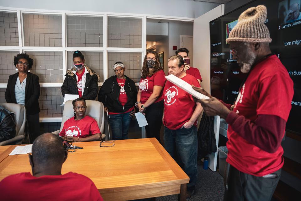November 01, 2023: MEMPHIS, TN - Members of the Memphis Tenants Union (in red shirts) listen as Norris Canceler, 85, reads his statement during the public comment section of the Nov. 1 the Health, Educational and Housing Facility Board of the City of Memphis meeting.