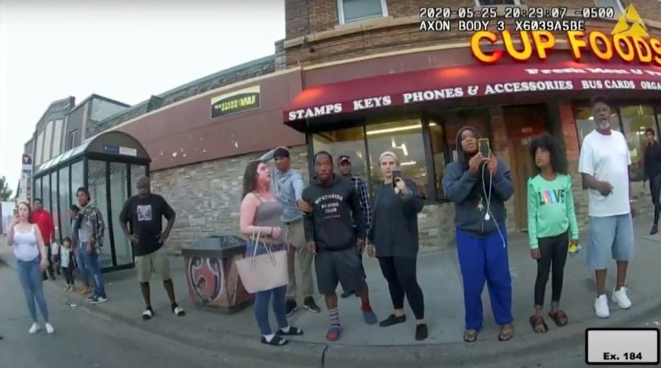 <div class="inline-image__caption"> <p>Darnella Frazier (3rd R) uses her mobile phone to record the arrest of George Floyd, in a still image taken from Minneapolis Police body camera video in Minneapolis, Minnesota, U.S. May 25, 2020. </p> </div> <div class="inline-image__credit"> Minneapolis Police Department/Handout via REUTERS </div>