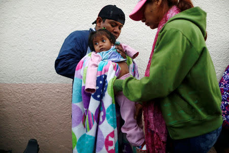 Member of a migrants caravan from Central America arrive at the end of their caravan journey through Mexico, prior to preparations for an asylum request in the U.S., in Tijuana, Baja California state, Mexico April 26, 2018. REUTERS/Edgard Garrido