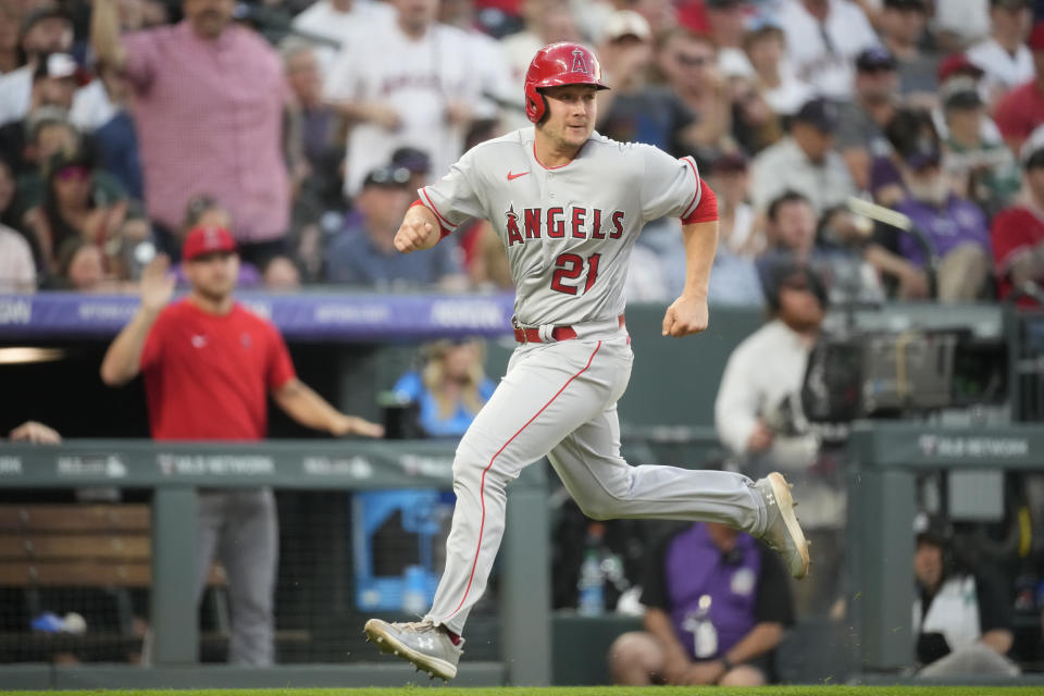 Los Angeles Angels' Matt Thaiss rounds third base to score after a double by Hunter Renfroe in the third inning of a baseball game against the Colorado Rockies, Saturday, June 24, 2023, in Denver. (AP Photo/David Zalubowski)