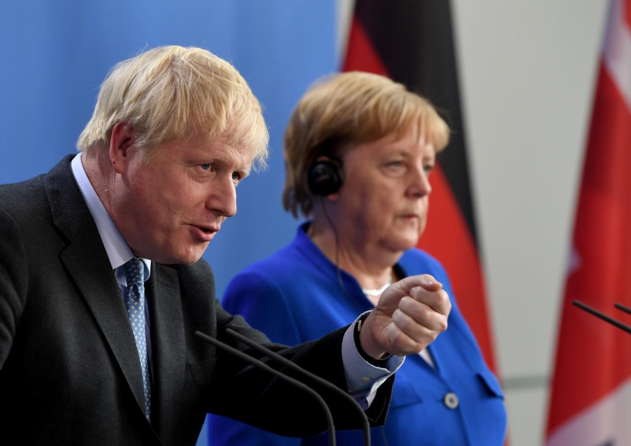 Boris Johnson and Angela Merkel give a joint press statement at the Chancellery in Berlin: EPA