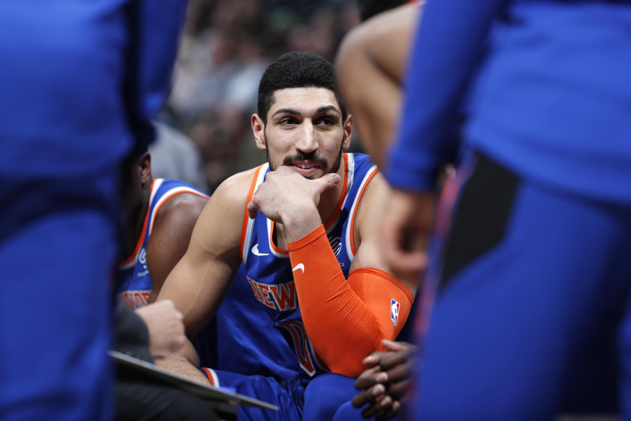 Enes Kanter might have some regrets after eating seven burgers. (AP Photo/David Zalubowski)