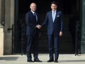 Italian Premier Giuseppe Conte, right, shakes hands with Malta Prime Minister Joseph Muscat on the occasion of the Mediterranean Summit of Southern EU countries in Valetta, Malta, Friday, June 14, 2019. (AP Photo/Jonathan Borg)