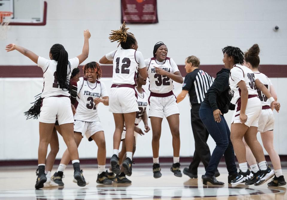 The Tigers celebrate their 42-40 victory over the Wildcats during the Booker T. Washington vs Pensacola girls basketball game at Pensacola High School on Friday, Jan. 20, 2023.