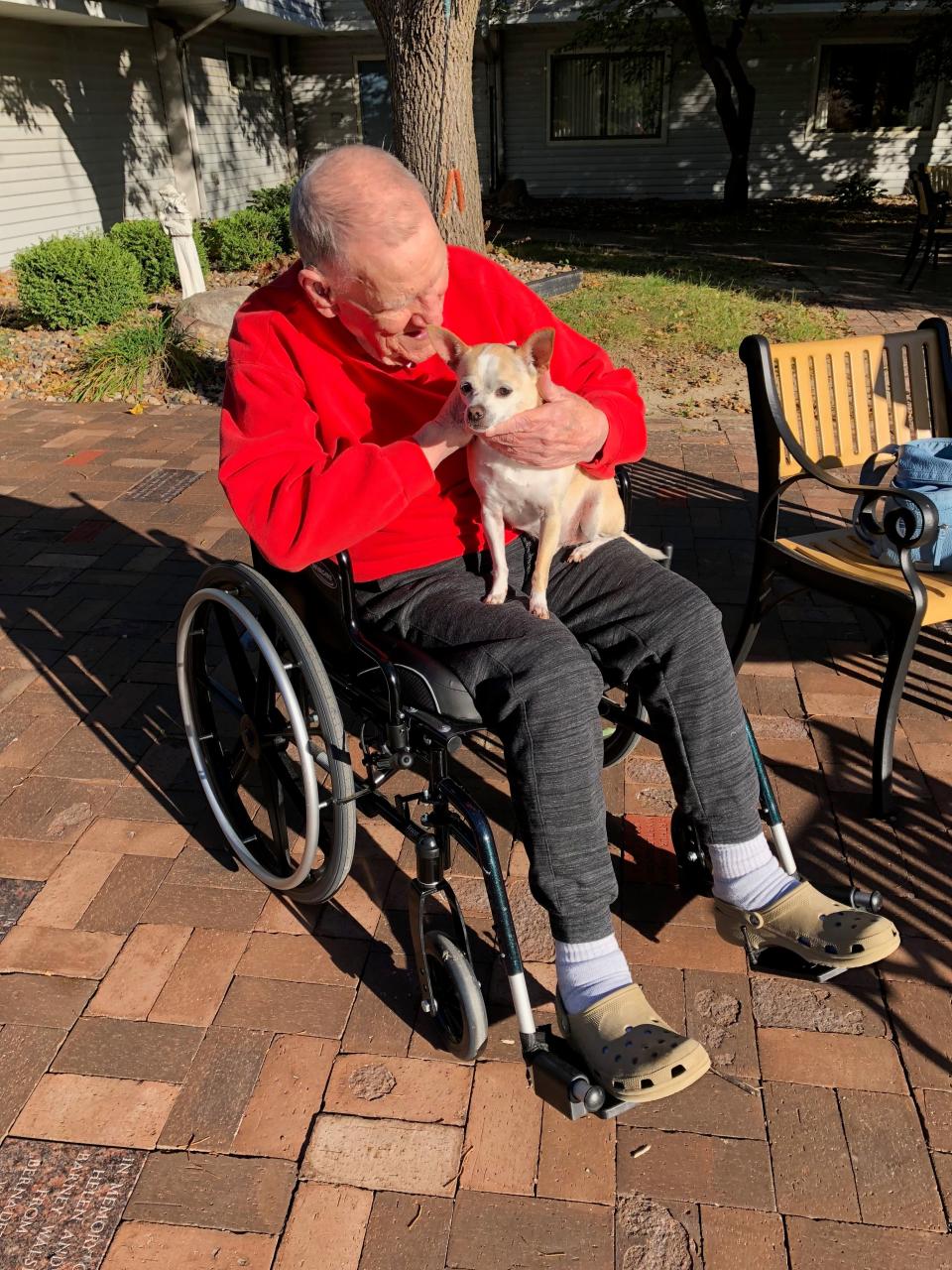 This is James "Milt" Ferguson Sr. with his dog Macaroni. He was 91 years old, a veteran of World War II and died from a head injury he received in the Veterans Affairs nursing home in Des Moines.