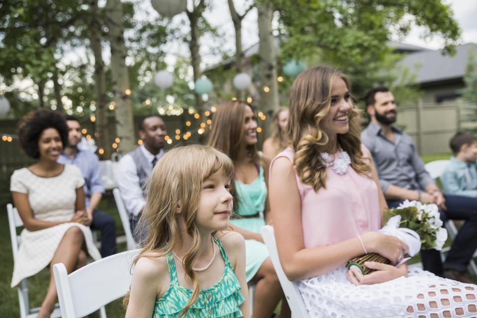 Smiling wedding guests enjoying backyard wedding