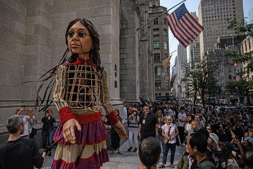 'Little Amal', a giant puppet depicting a Syrian refugee girl, walks outside St. Patrick's Cathedral in New York on September 18, 2022.