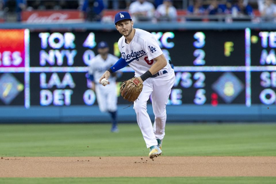 Los Angeles Dodgers shortstop Trea Turner prepares to throw out Miami Marlins' Jesus Aguilar