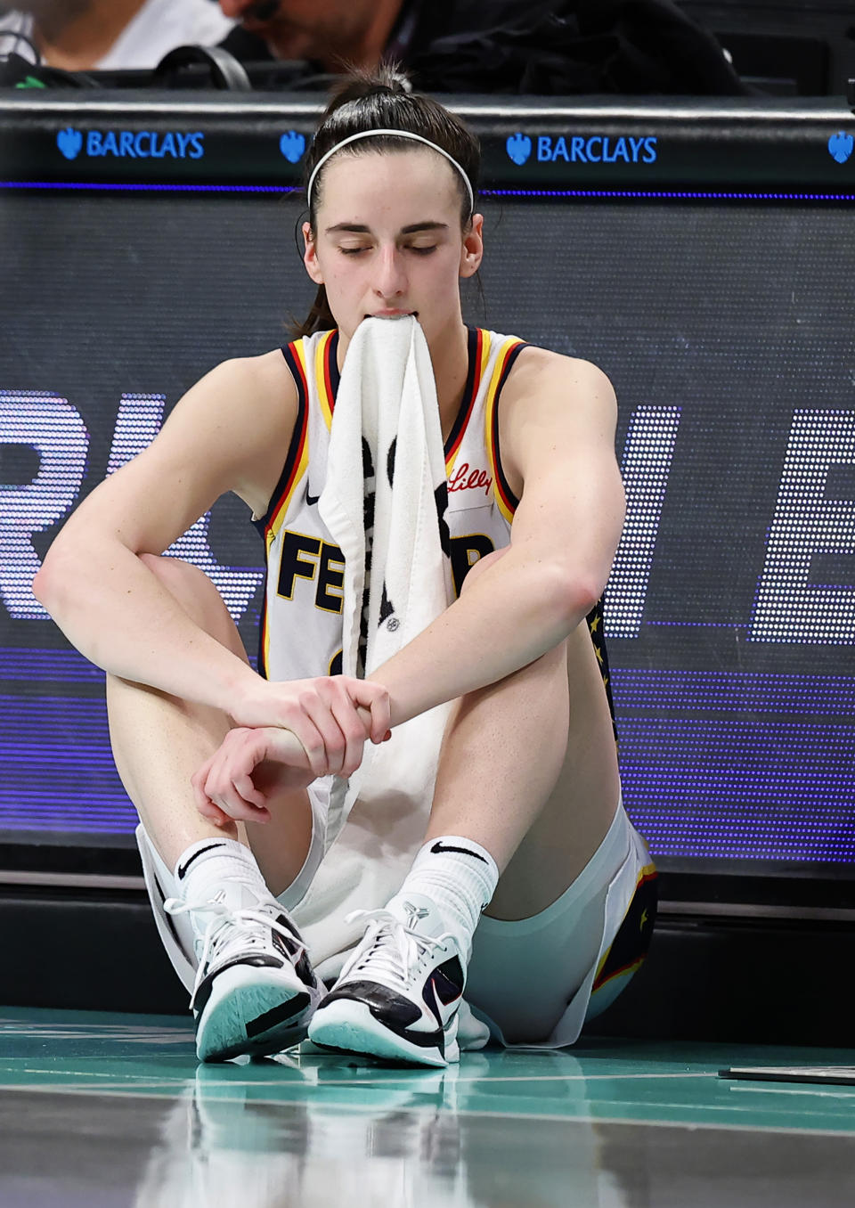Indiana Fever guard Caitlin Clark (22) waits to enter during the second half of a WNBA basketball game against the New York Liberty, Saturday, May 18, 2024, in New York. The Liberty won 91-80. (AP Photo/Noah K. Murray)