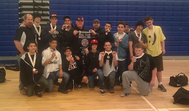 Kelseyville wrestling coach Rob Brown, holding the left side of the team banner, stopped a dangerous driver — Flickr