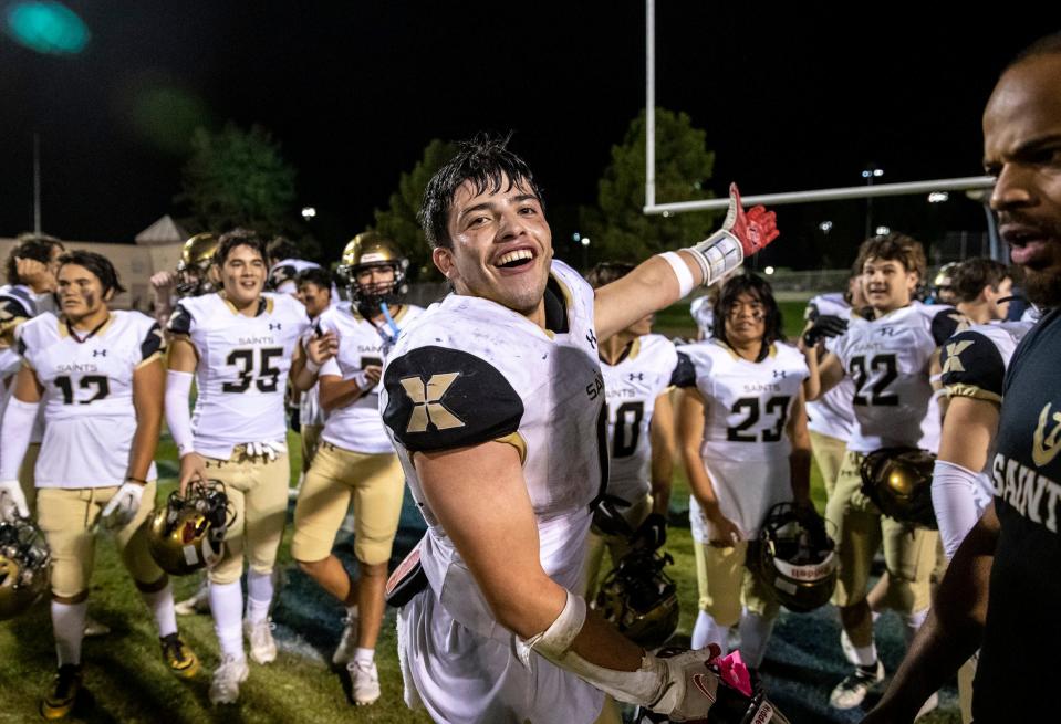 Xavier Prep's Jesus Pazos (0) gestures to the scoreboard after it's turned off while celebrating their first-round CIF Division 10 playoff game in La Quinta, Calif., Friday, Nov. 3, 2023.