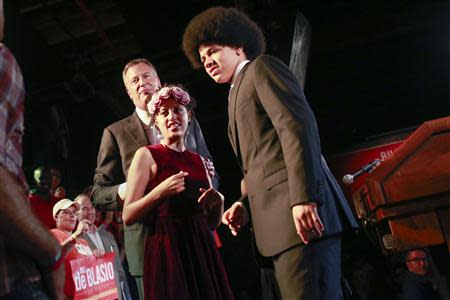 Democratic candidate for New York City mayor Bill de Blasio stands behind his daughter Chiara and son Dante during his mayoral primary results party in New York September 10, 2013. REUTERS/Shannon Stapleton