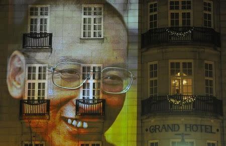 An image of Liu Xiaobo is projected on a hotel in the centre of Oslo following the Nobel Peace Prize ceremony December 10, 2010. REUTERS/Toby Melville/Files