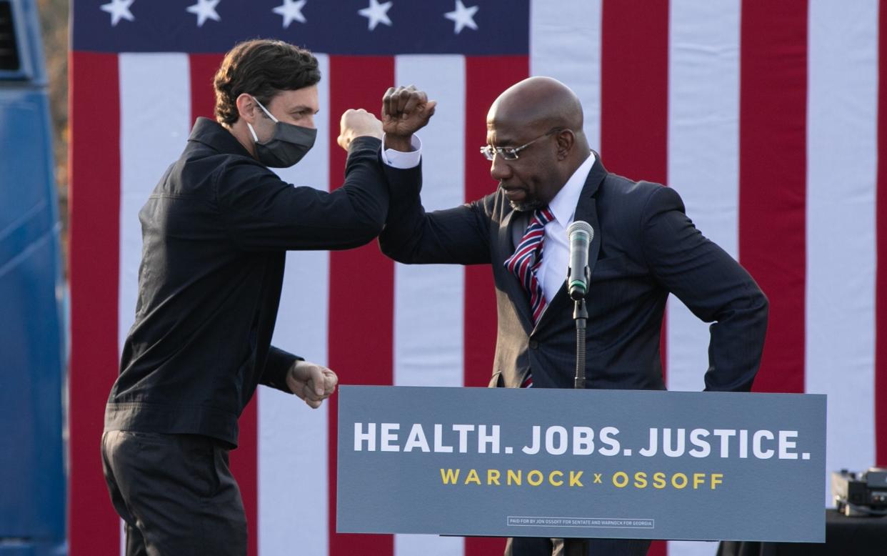 Jon Ossoff, left, and Reverend Raphael Warnock are the Democratic candidates for the two open US Senate seats in Georgia  - Jessica McGowan/Getty Images