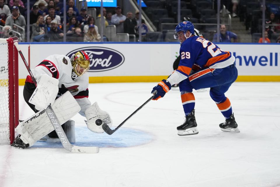 Ottawa Senators goaltender Joonas Korpisalo (70) stops a shot by New York Islanders' Brock Nelson (29) during the second period of an NHL hockey game Thursday, Oct. 26, 2023, in Elmont, N.Y. (AP Photo/Frank Franklin II)