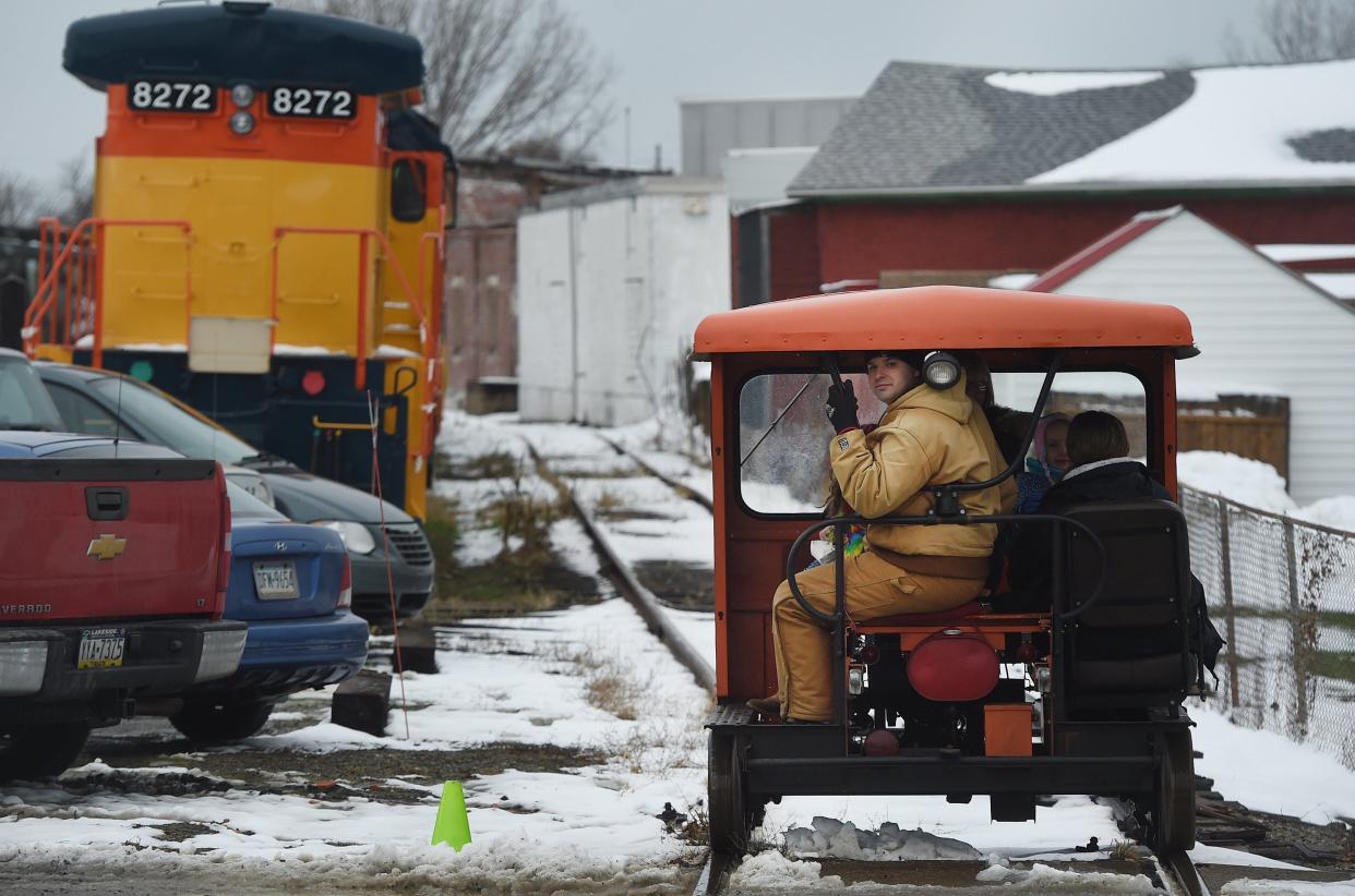 Alex Hummel, of the Lakeshore Railway Historical Society in North East, operates a speeder car. Speeder rides will be part of Christmas at the Station.