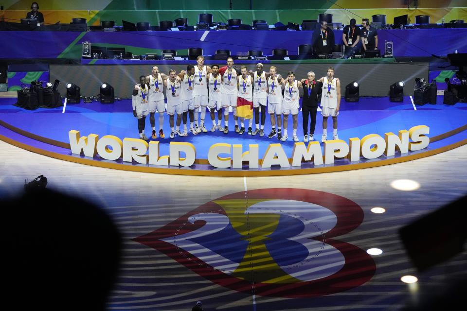 Germany poses with their gold medals after winning the championship game of the Basketball World Cup against Serbia in Manila, Philippines, Sunday, Sept. 10, 2023. (AP Photo/Aaron Favila)