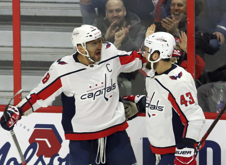Washington Capitals left wing Alex Ovechkin (8) celebrates his goal against the Ottawa Senators with right wing Tom Wilson (43) during the second period of an NHL hockey game Friday, Jan. 31, 2020, in Ottawa, Ontario. (Fred Chartrand/The Canadian Press via AP)