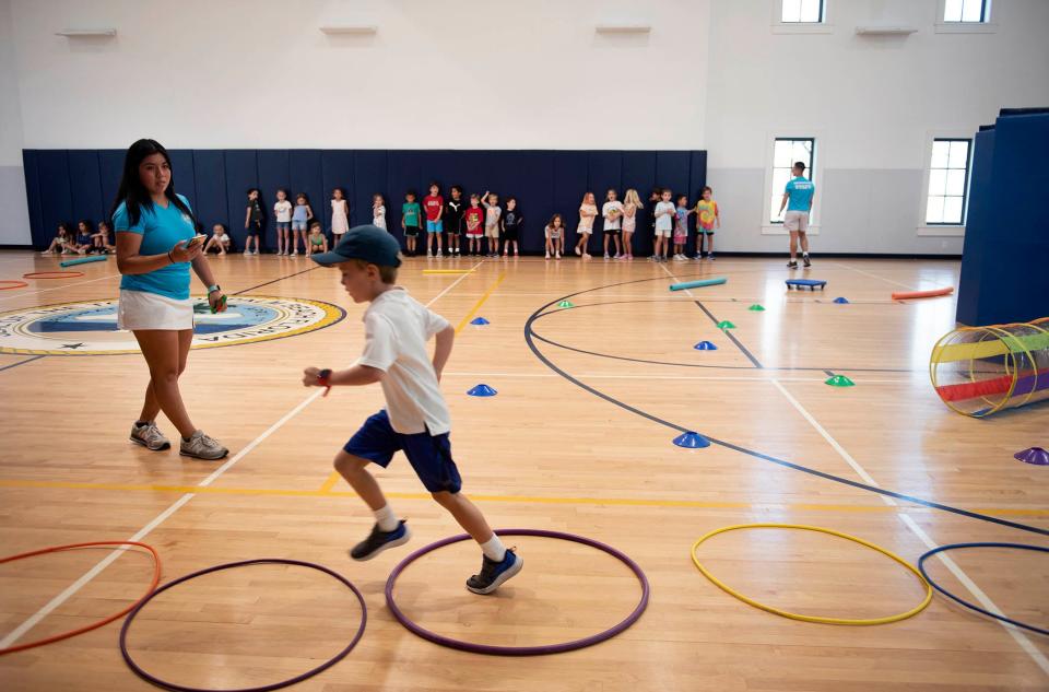 An obstacle course provides entertainment for Camp Palm Beach participants on July 19 after rainy weather sent them indoors at the Barbara and Morton Mandel Recreation Center.