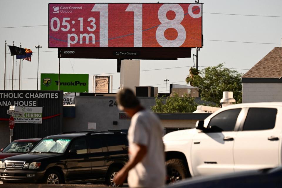 PHOTO: A billboard displays a temperature of 118 degrees during a record heat wave in Phoenix, July 18, 2023.  (Patrick T. Fallon/AFP via Getty Images)