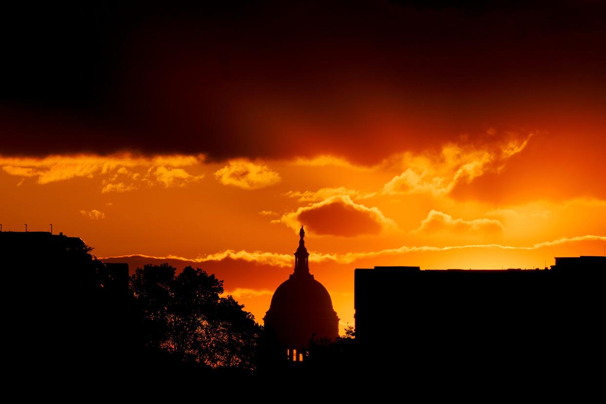 The U.S. Capitol Dome is silhouetted against the rising sun, Friday, April 30, 2021 in Washington.